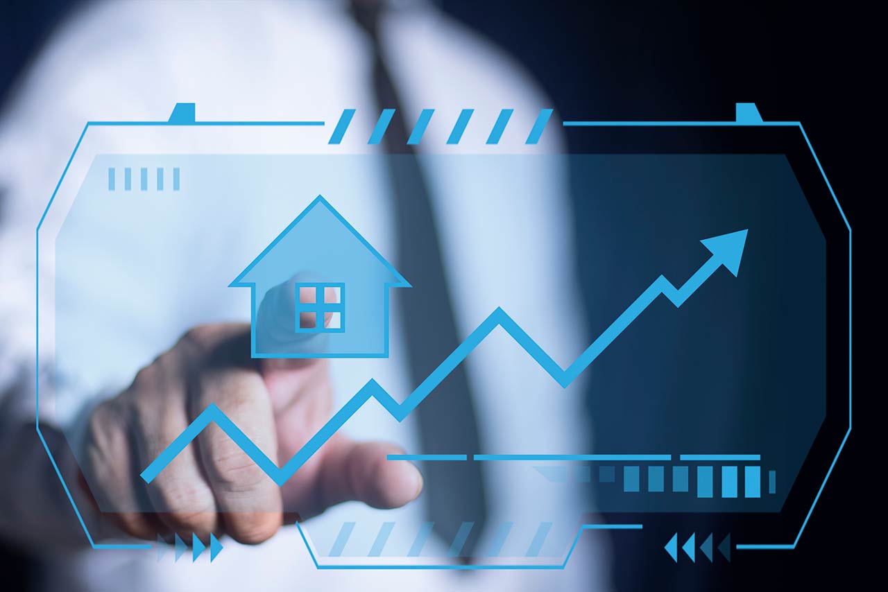 Businessman hand pointing virtual house icon for analyzing property value